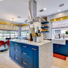 Modern Blue And White Kitchen With Red And Metallic Accents And Marble Tile