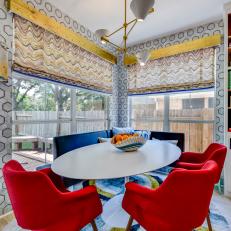 Midcentury Modern Breakfast Nook With Blue And Red Seating And Metallic Pendant And Accents