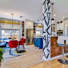 Modern Eclectic Kitchen With Breakfast Nook And Blue Cabinets With Marble Wall Tile
