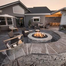 Contemporary Backyard Patio Retreat With Gas Fire Pit  With Seating And Natural Stone Garden Wall