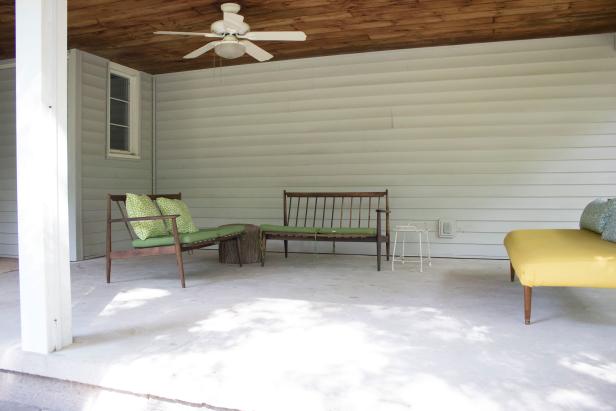 Removing vinyl siding from a covered porch.