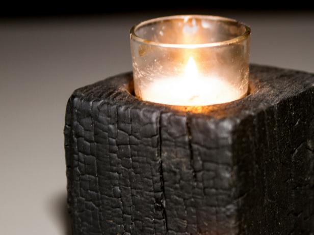 Close Up of Burned Wooden Candle Holder With Votive