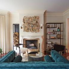 Bright, Eclectic Living Room With Large Turquoise Chair, Modern-Industrial Shelving and Traditional Fireplace Surround 