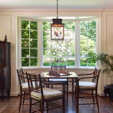 Traditional Family Room With Game Table With Pendant Light And Bay Window
