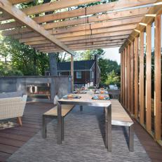 Contemporary Deck With Gas Fireplace And Dining Area With Pergola