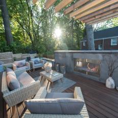Contemporary Patio Deck With Wicker Sitting Area And Modern Concrete Gas Fireplace
