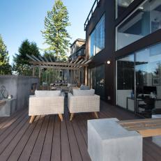Contemporary Deck With Modern Wicker Seating And Concrete Gas Fireplace