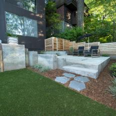 Contemporary Backyard Sitting Area With Concrete Pavers And Stairs With Modern Wood Fence