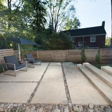 Contemporary Backyard Sitting Area With Concrete Pavers And Stairs