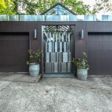 Modern Double Garage Doors With Metal And Glass Skylights And Entrance