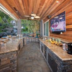 Outdoor Kitchen With Wood Paneling