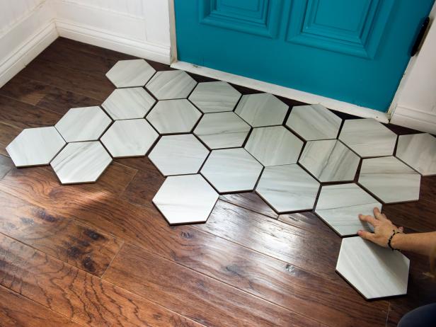 A Tile Rug Within Hardwood Floor, Tile On Wood Floor Installation