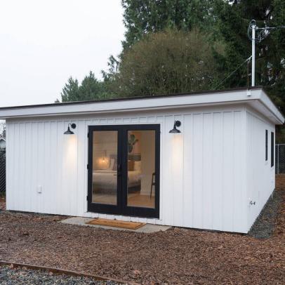 Modern White Guest House with Board and Batten Siding