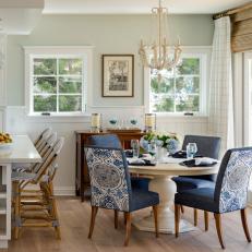 Blue Cottage Dining Area With White Chandelier