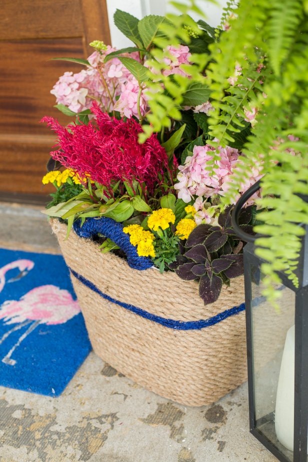 Has your plastic laundry basket seen better days? Give it new life as a chic, nautical-inspired planter.