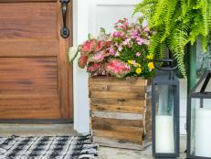 Looking for an oversized front porch planter that won't break the bank? Learn how to upcycle an inexpensive plastic trash can into a farmhouse-chic flower pot for less than $10.