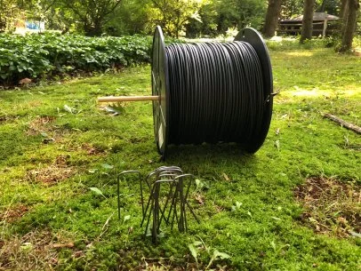 Burying invisible fence wire outlet