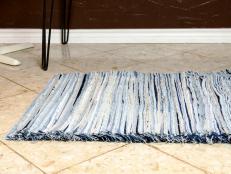 Put the softness of a well-worn pair of jeans underfoot by transforming old denim into a soft and fringy rug.