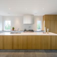 Modern Kitchen With Wood Cabinets and Matching Island