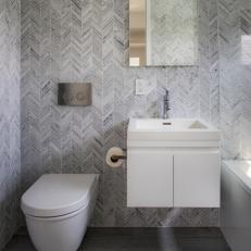 Guest Bathroom With Gray Herringbone Tile