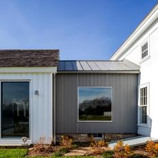 Farmhouse Additions Clad in Standing Seam Siding