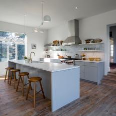 Modern Kitchen Boasts Floating Shelves, Marble Island