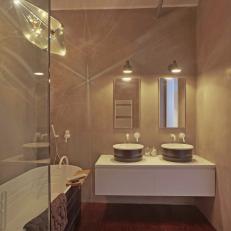 Modern Master Bathroom Pairs Sleek Mirrors, Floating Vanity