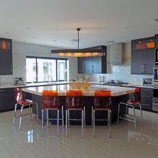 Chef Kitchen With Orange Lucite Barstools