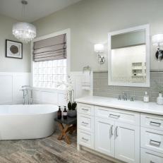 Contemporary White Master Bathroom With Soaking Tub And Glass Subway Tile Backsplash