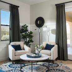 Contemporary Blue And White Master Bedroom Sitting Area With White Chairs And Round Table
