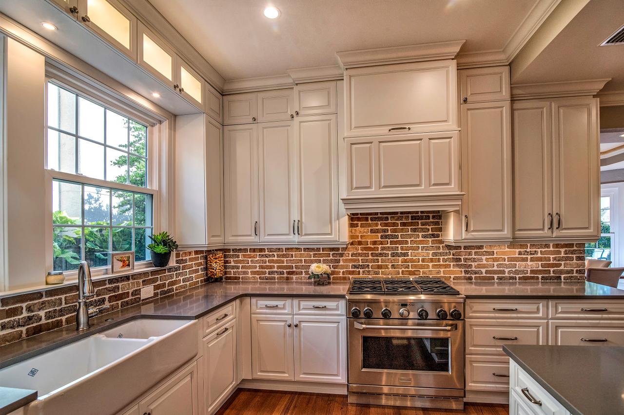 Contemporary Kitchen With White Cabinets And Brick Backsplash And Gray Countertops Hgtv