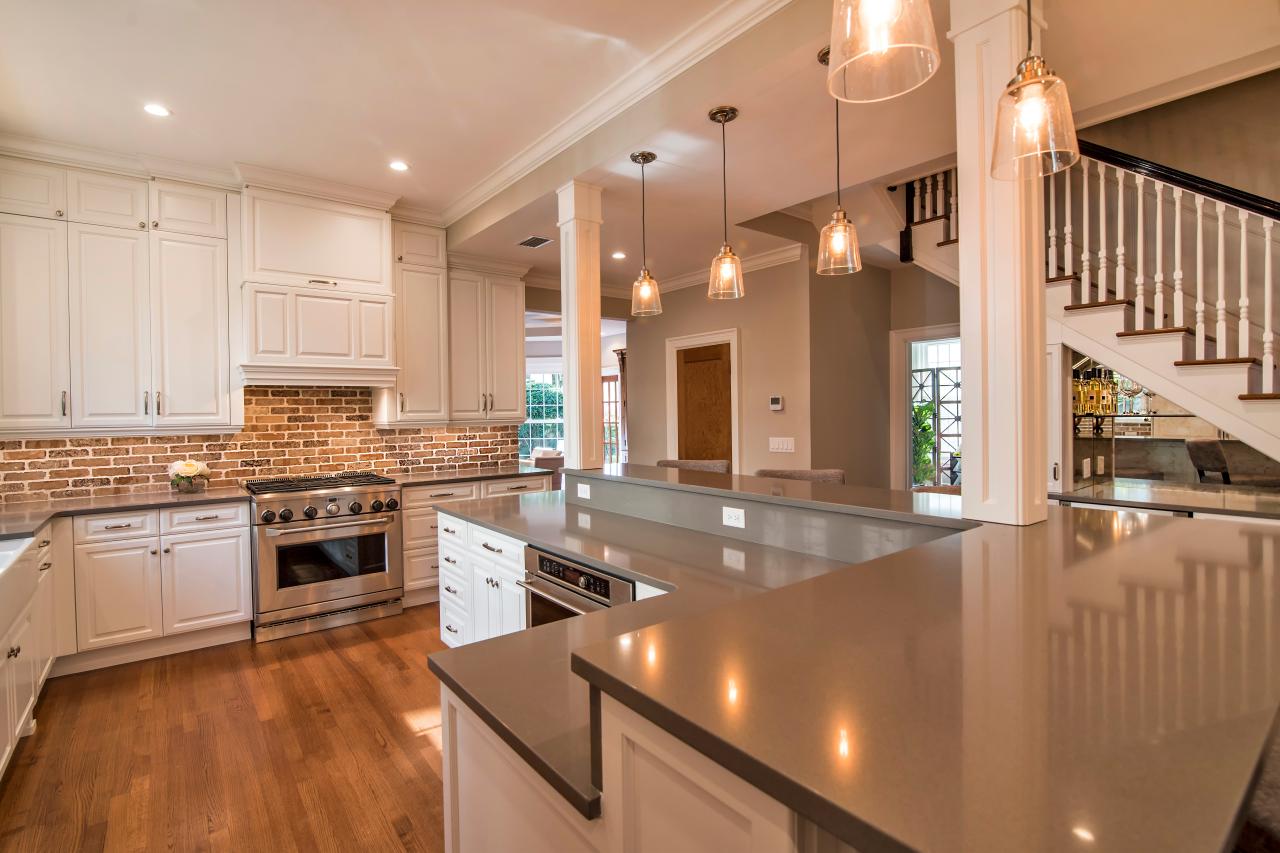 Contemporary White Kitchen With Brick Backsplash And Pendant