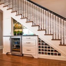 Traditional Wood Staircase With Bar And Wine Refrigerator And Storage