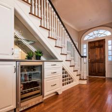 Traditional Staircase And Entrance With Built In Wine Bar And Storage