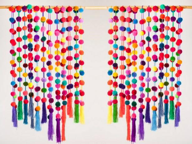 Garlands of Pom Poms Hanging Vertically From Pole