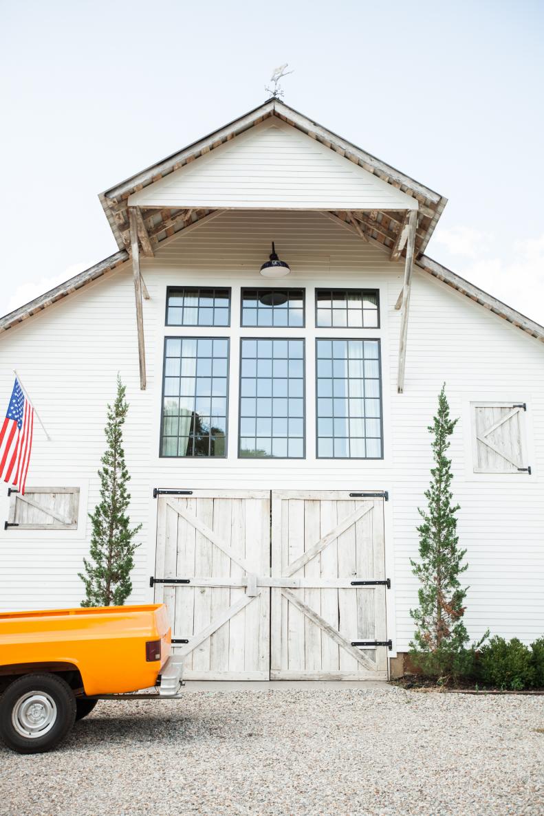 Wood Barn Doors Welcome Visitors to Farmhouse
