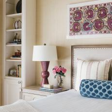 Traditional White Bedroom With Blue And Purple Textile Art 