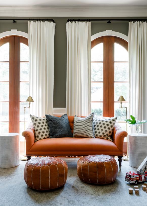 Traditional Loveseat With Orange Upholstery And Blue Accent Pillows
