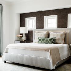 Contemporary Master Bedroom With Upholstered Headboard And Accent Wall