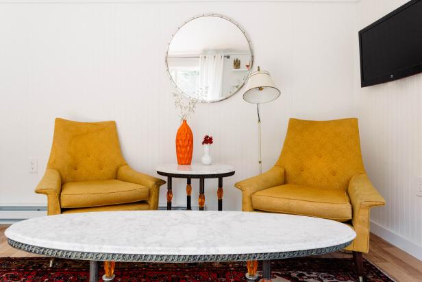 eclectic sitting area with yellow armchairs