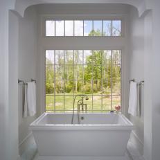 White Country Farmhouse Master Bathroom Soaking Tub And Marble Tile Floor