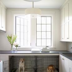 White Country Farmhouse Laundry Room With Modern Pendants And Dog Kennels