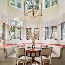Breakfast Nook With High Ceiling and Curved Banquette