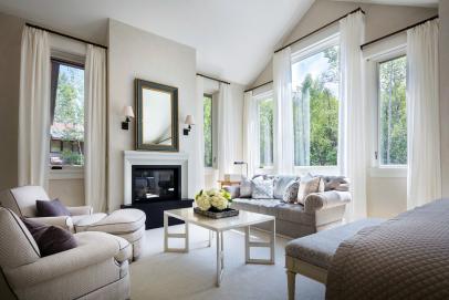 Master Bedroom Sitting Area With Fireplace And Large Windows