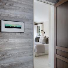 Hallway With Rustic Wood Siding Looking Into Guest Room 