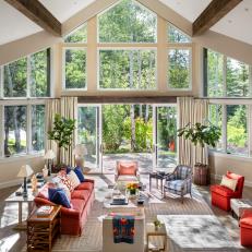 Living Room With Vaulted Ceiling and Wall of Windows