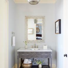 Gray Guest Bathroom With Modern Marble Top Vanity And Accessories