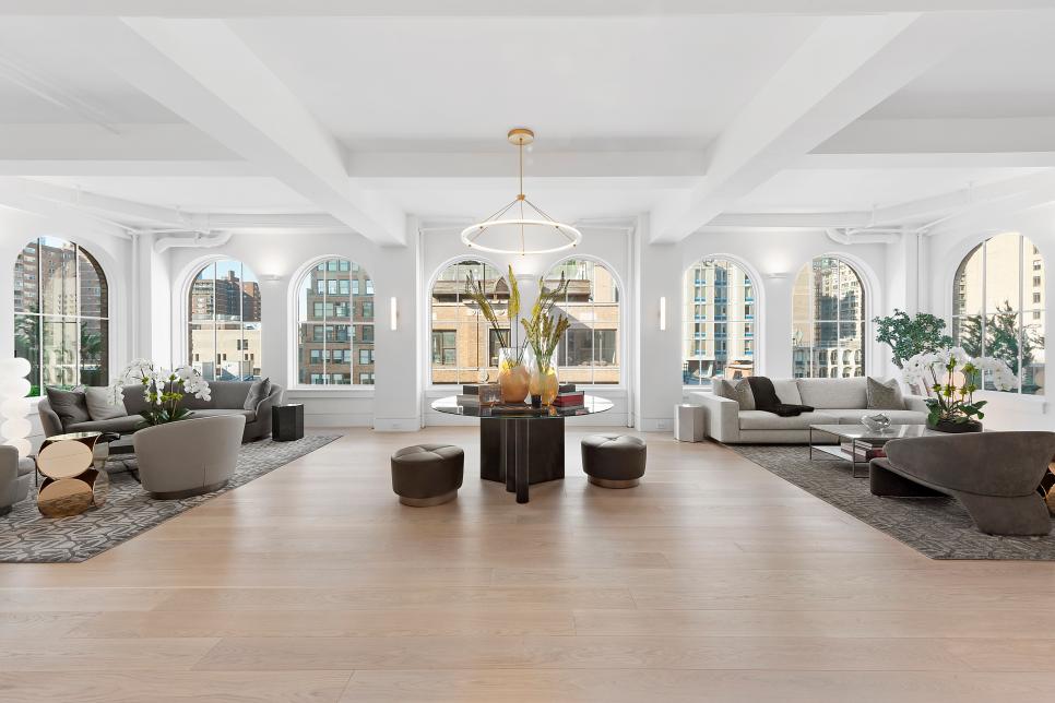 Large Great Room With Arched Windows and Coffered Ceiling