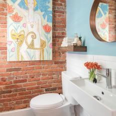 Blue Bathroom With Exposed Brick Wall