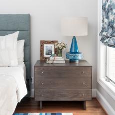 Contemporary Master Bedroom With Blue Table Lamp